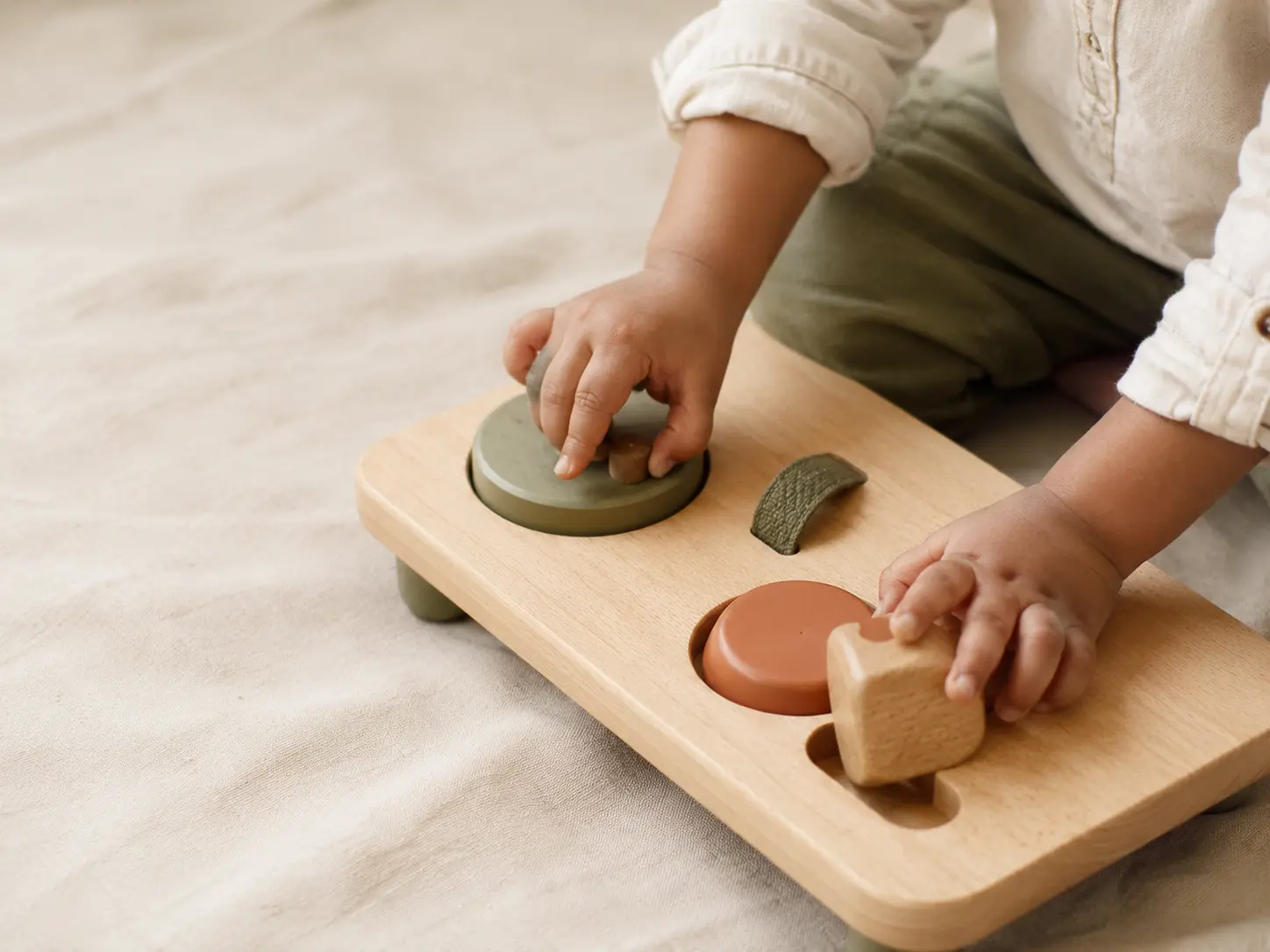 Small hands exploring a toy